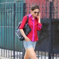 Katie Holmes chats on her cellphone whilst walking